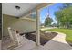 Charming front porch with rocking chairs and beautifully landscaped yard at 1100 Rosetta Dr., Conway, SC 29526