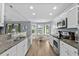 Bright kitchen features granite countertops, stainless appliances, and an adjacent breakfast nook at 1100 Rosetta Dr., Conway, SC 29526