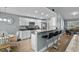 Bright kitchen with white cabinetry, granite countertops, and breakfast bar at 1100 Rosetta Dr., Conway, SC 29526