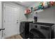 Laundry room with front-load washer and dryer, wire shelving, and a white door at 1100 Rosetta Dr., Conway, SC 29526