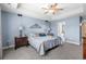 Main bedroom boasts a trey ceiling, ceiling fan, and ensuite bathroom at 1100 Rosetta Dr., Conway, SC 29526