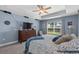 Beautiful main bedroom boasts a trey ceiling, ceiling fan, and a large window at 1100 Rosetta Dr., Conway, SC 29526