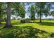 Charming outbuilding nestled on a spacious lot with verdant lawn and mature trees at 1100 Rosetta Dr., Conway, SC 29526