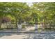 Park entrance featuring archway, well-maintained brick path, and mature trees at 1100 Rosetta Dr., Conway, SC 29526