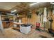 Organized shed interior featuring ample storage, workbench, and organized gardening tools at 1100 Rosetta Dr., Conway, SC 29526