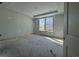Bright bedroom with natural light streaming through two windows, awaiting personal touches and finishing at 1221 Lady Bird Way, North Myrtle Beach, SC 29582