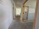 Bright hallway with natural light flowing through the doorway, showcasing the home's open layout at 1221 Lady Bird Way, North Myrtle Beach, SC 29582