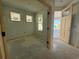 Unfinished living room with ample natural light streaming through windows, framed by light wood trim accents at 1221 Lady Bird Way, North Myrtle Beach, SC 29582
