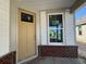 Charming porch with brick accents, featuring a front door and a window, awaiting completion at 1221 Lady Bird Way, North Myrtle Beach, SC 29582