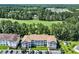 A condo complex featuring lush golf course views and surrounded by verdant trees and neighborhood at 125 S Shore Dr. # 204, Longs, SC 29568