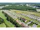 Aerial view of an expansive community with modern homes, green spaces, and convenient parking at 125 South Shore Dr. # 204, Longs, SC 29568