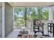 Relaxing balcony view with furnishings overlooking a lush, green landscape at 125 South Shore Dr. # 204, Longs, SC 29568