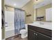 Bathroom with a shower-tub combination, vanity, and themed shower curtain at 125 South Shore Dr. # 204, Longs, SC 29568