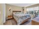 Cozy bedroom with a queen bed, natural light, and coastal-themed accents at 125 South Shore Dr. # 204, Longs, SC 29568