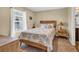 Comfortable bedroom with a queen bed, natural light and simple decor at 125 South Shore Dr. # 204, Longs, SC 29568