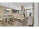 Cozy dining area featuring modern lighting, adjacent to the open kitchen with stainless steel appliances at 125 South Shore Dr. # 204, Longs, SC 29568