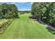 Scenic view of the lush, green golf course with a distant view of the surrounding community at 125 South Shore Dr. # 204, Longs, SC 29568