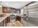 Well-equipped kitchen featuring stainless steel appliances, sleek countertops, and ample cabinet space at 125 South Shore Dr. # 204, Longs, SC 29568