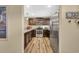 Modern kitchen with stainless steel appliances, dark wood cabinetry, and stylish countertops at 125 South Shore Dr. # 204, Longs, SC 29568