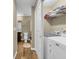 Convenient laundry area with washer, dryer, and shelving for storage at 125 South Shore Dr. # 204, Longs, SC 29568