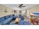 Open-concept living room with kitchen view, featuring a large blue sectional and nautical decor at 125 South Shore Dr. # 204, Longs, SC 29568