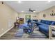 Inviting living room with comfortable blue sectional sofa and nautical-themed decor at 125 South Shore Dr. # 204, Longs, SC 29568
