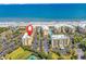 An aerial view shows the condo buildings near the ocean, highlighting its prime location at 139 S Dunes Dr. # 304, Pawleys Island, SC 29585