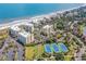 This aerial view features the beachfront condo community, with pools and easy beach access at 139 S Dunes Dr. # 304, Pawleys Island, SC 29585