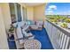 Inviting balcony with comfortable seating and scenic views of lush landscaping at 139 S Dunes Dr. # 304, Pawleys Island, SC 29585