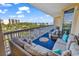 Relaxing balcony offering ample seating and picturesque views of the surrounding area at 139 S Dunes Dr. # 304, Pawleys Island, SC 29585
