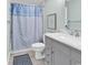 Updated bathroom with modern vanity, fixtures, and stylish shower curtain at 139 S Dunes Dr. # 304, Pawleys Island, SC 29585