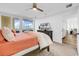 Bedroom with balcony access offering natural light and exterior views at 139 S Dunes Dr. # 304, Pawleys Island, SC 29585