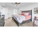 Comfortable bedroom with a ceiling fan, dresser, and ensuite bathroom at 139 S Dunes Dr. # 304, Pawleys Island, SC 29585