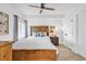 Charming bedroom features natural wood accents, a ceiling fan, and a closet for storage at 139 S Dunes Dr. # 304, Pawleys Island, SC 29585