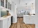 Modern kitchen with white cabinets, marble countertops, and an open floor plan at 139 S Dunes Dr. # 304, Pawleys Island, SC 29585