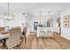 Open living area with a modern kitchen, dining area, and stylish decor at 139 S Dunes Dr. # 304, Pawleys Island, SC 29585