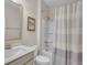 Bathroom featuring a single vanity, toilet, bathtub, and shower with a gray and white shower curtain at 1459 Villena Dr., Myrtle Beach, SC 29579
