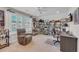 Bedroom with a ceiling fan, recliner, work desk, and shelves filled with movie memorabilia at 1459 Villena Dr., Myrtle Beach, SC 29579
