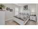 Neutral bedroom with white molding, shuttered window, a bed, and bedside tables with lamps at 1459 Villena Dr., Myrtle Beach, SC 29579