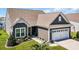 Attractive single-story home featuring neutral siding, well-kept lawn, and an attached garage at 1459 Villena Dr., Myrtle Beach, SC 29579