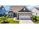 Charming single-story home featuring a tidy yard, two-car garage, and well-maintained landscaping at 1459 Villena Dr., Myrtle Beach, SC 29579