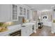 Wet bar with stylish cabinetry, quartz countertops, and designer backsplash at 1459 Villena Dr., Myrtle Beach, SC 29579