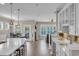 Open-concept kitchen with bar seating, dining area, and seamless access to the living space at 1459 Villena Dr., Myrtle Beach, SC 29579