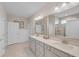 Bright main bathroom with double sinks, vanity, and tiled walk-in shower at 1459 Villena Dr., Myrtle Beach, SC 29579