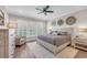 Serene main bedroom featuring a ceiling fan, ample natural light, and soft neutral tones at 1459 Villena Dr., Myrtle Beach, SC 29579