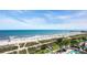 Aerial view of a pool and oceanfront area with colorful umbrellas at 1700 N Ocean Blvd. # 651, Myrtle Beach, SC 29577