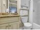 This bathroom features a well-lit vanity, a granite countertop, and fresh white towels and bath accessories at 1700 N Ocean Blvd. # 651, Myrtle Beach, SC 29577