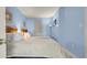 Well-lit bedroom with twin beds, blue walls, and modern decor at 1700 N Ocean Blvd. # 651, Myrtle Beach, SC 29577