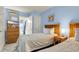 Comfortable bedroom with twin beds, television, and ensuite bathroom at 1700 N Ocean Blvd. # 651, Myrtle Beach, SC 29577