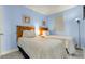 Bright bedroom with two twin beds, light blue walls, and decorative artwork at 1700 N Ocean Blvd. # 651, Myrtle Beach, SC 29577